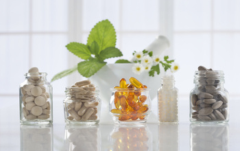 A line up of supplements in small glass bottles