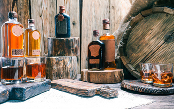 Bottles of whiskey on wood pedestals